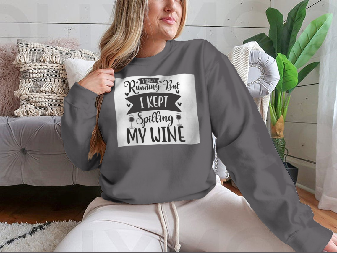 A cozy sweatshirt featuring the humorous phrase 'I Tried Running But I Kept Spilling My Wine', perfect for wine lovers.